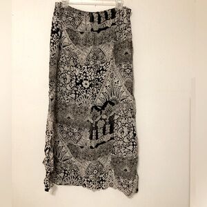 Chicos Design NWOT skirt size medium length 35” waist is elastic 19” length.